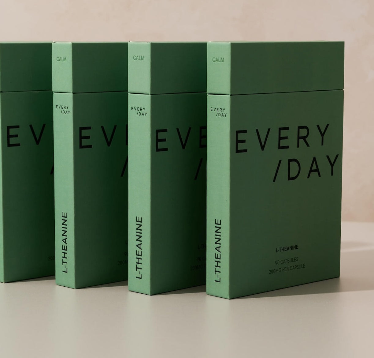 Everyday Supplements L-Theanine packaging standing upright in a neat row, showcasing the sleek, minimal design.